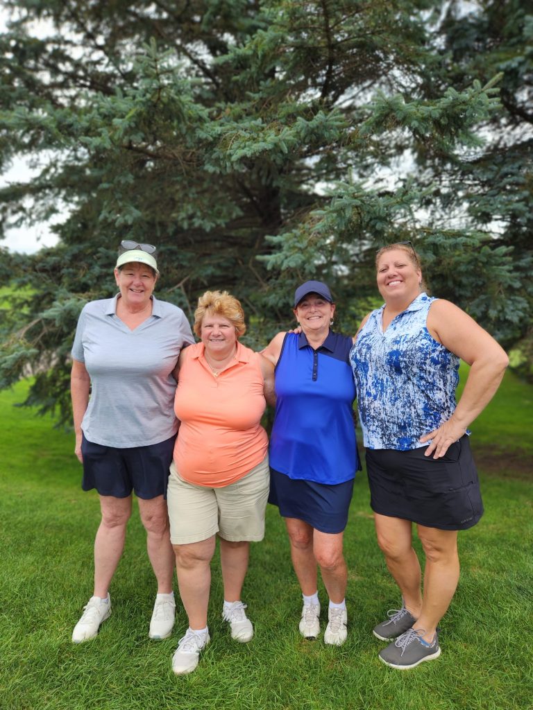 Women's Closest to Pin Winner Margaret Kendziorek (in orange blouse) 2025 women's closest to pin winner